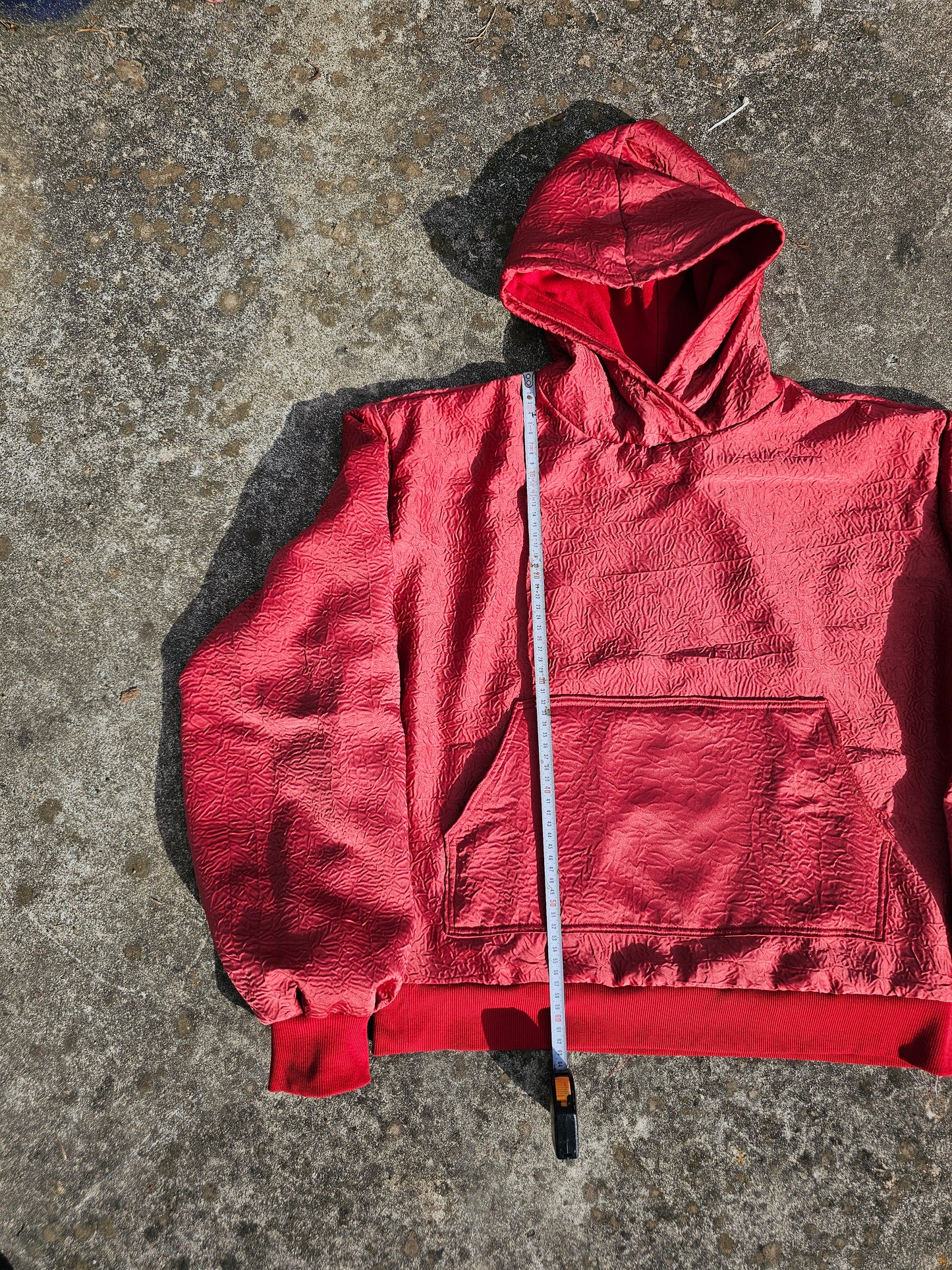 wrinkled red hoodie