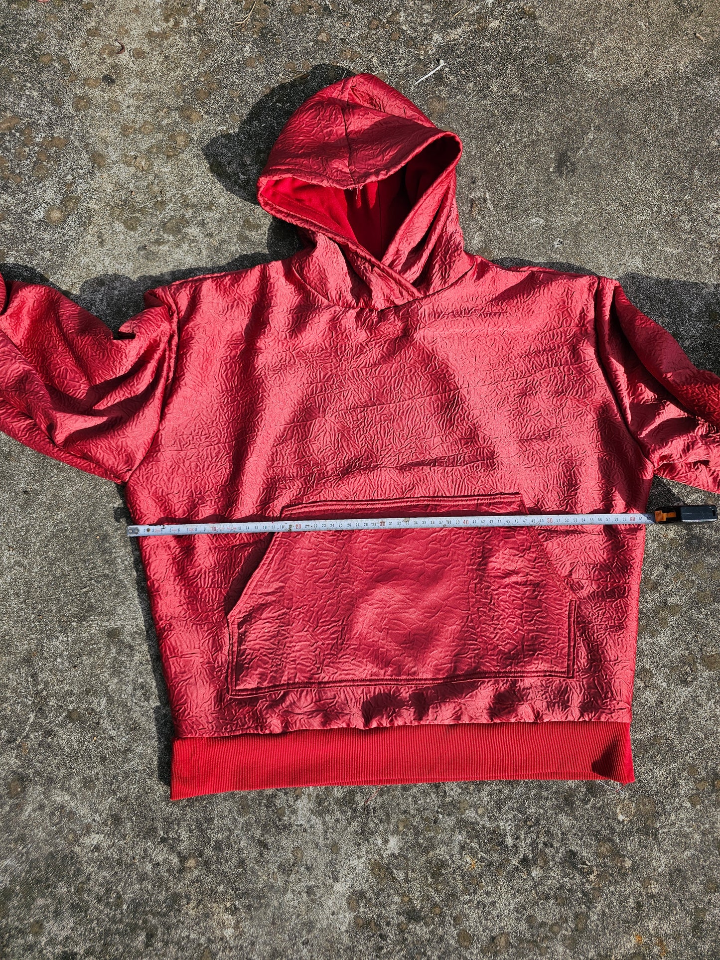 wrinkled red hoodie